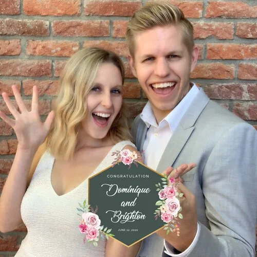 A booth photo of a couple with a custom overlay reading their names and wedding date